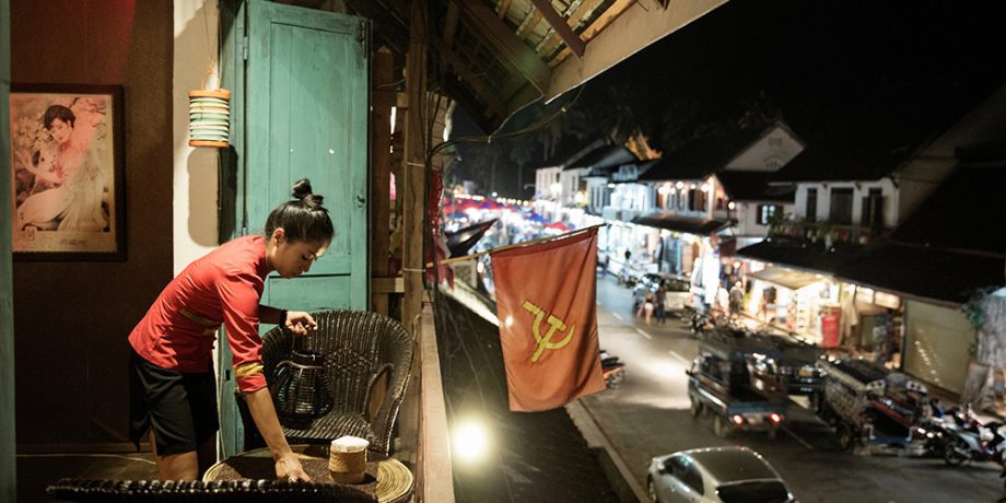 LAOS, NOVEMBER 2015. Luang Prabang, once considered a place for romantic dreamers, today is a magnet for expats in search of fortune in the new business of art and culture. A woman prepares a table at one of the many restaurants cropping up on the main promenade. Luang Prabang, Laos, 2015. @Giulio Di Sturco